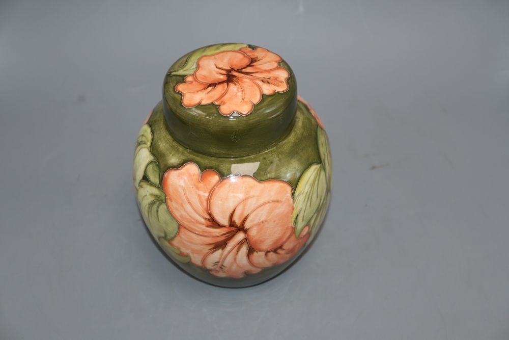 A Moorcroft hibiscus pattern jar and cover, height 20cm